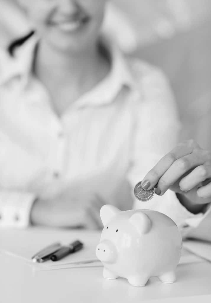 woman putting money in bank account